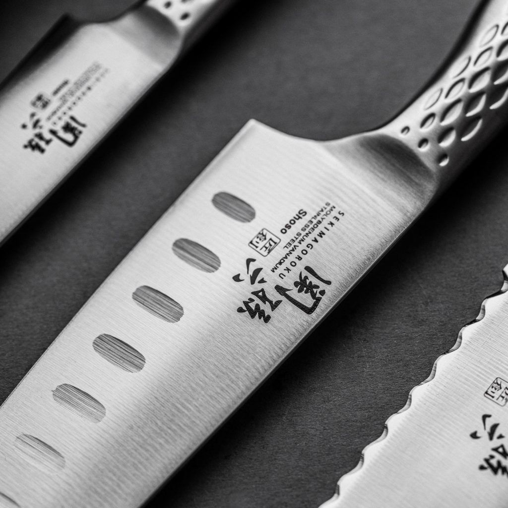 Kai Europe Santoku mit Kullenschliff Fabrikverkauf