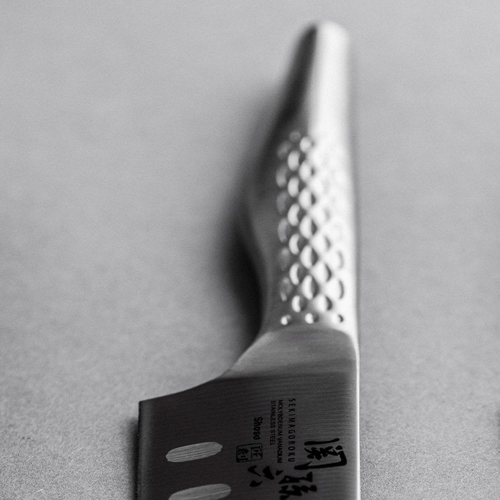 Kai Europe Santoku mit Kullenschliff Fabrikverkauf